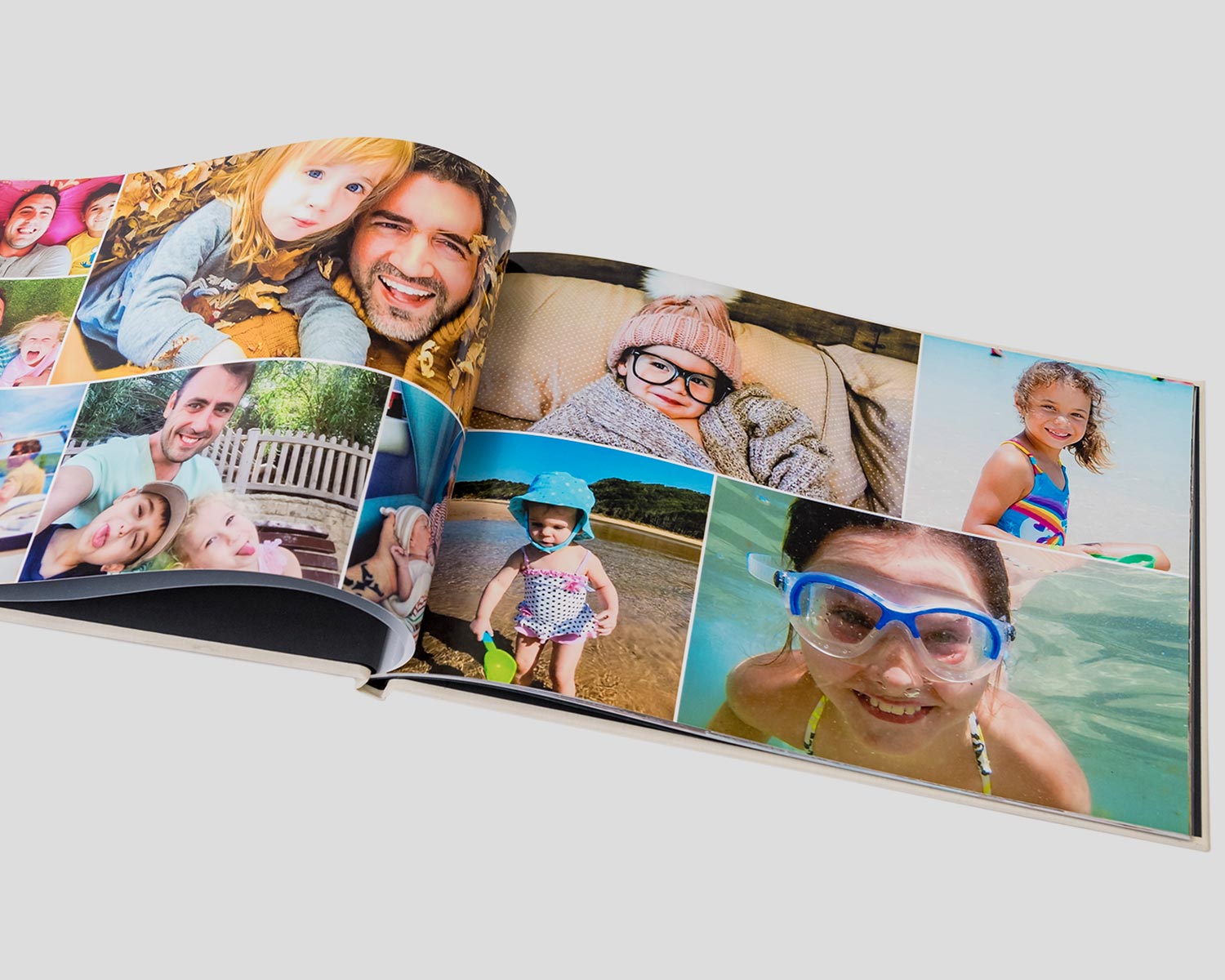 Opened personalised photo book with family photos on display